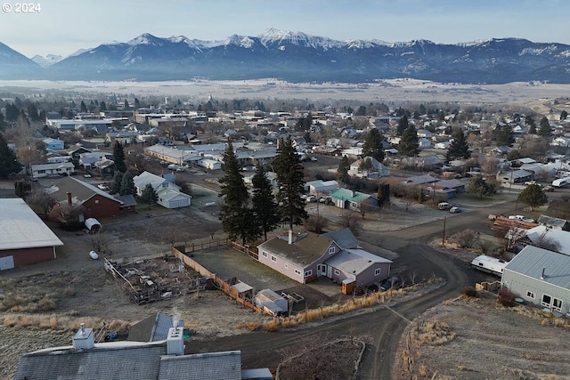 birds eye view of property featuring a mountain view