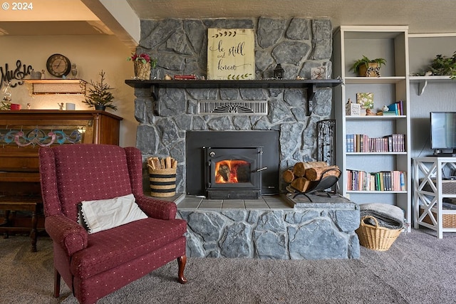 sitting room with carpet flooring and a fireplace