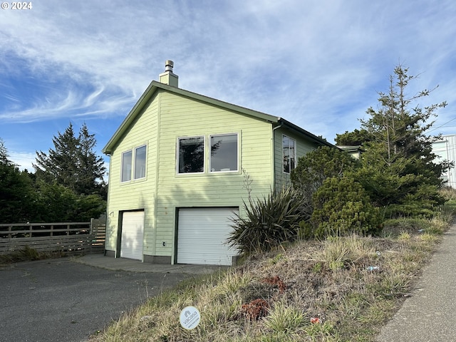 view of side of property featuring a garage