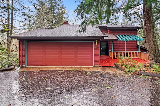 view of front of house with a garage and a porch