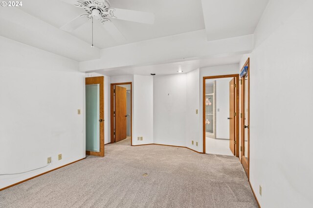 spare room with light carpet and ceiling fan