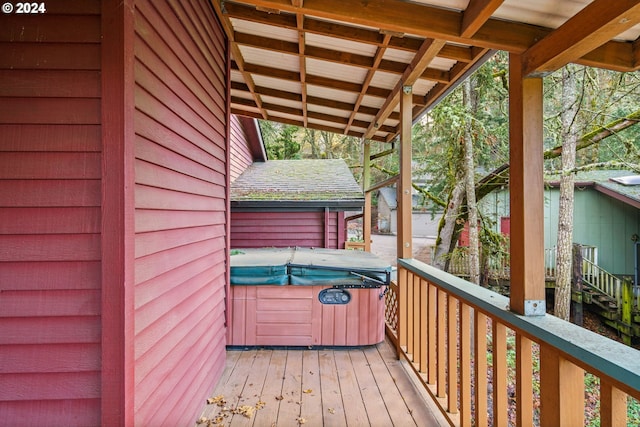 deck featuring a hot tub