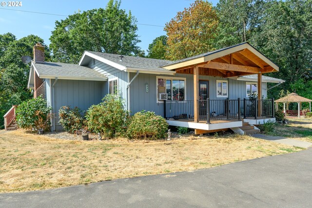 view of front of home featuring a gazebo and covered porch