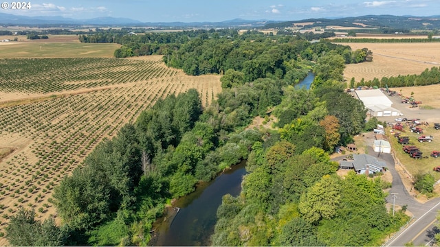 drone / aerial view featuring a water view and a rural view