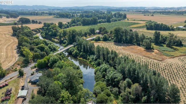 aerial view with a rural view and a water view