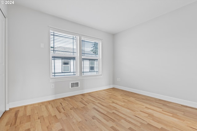 spare room featuring light hardwood / wood-style flooring