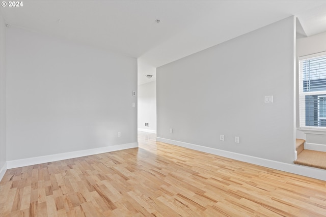 spare room featuring light hardwood / wood-style floors