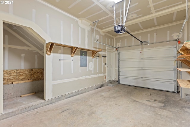 garage featuring electric panel and a garage door opener