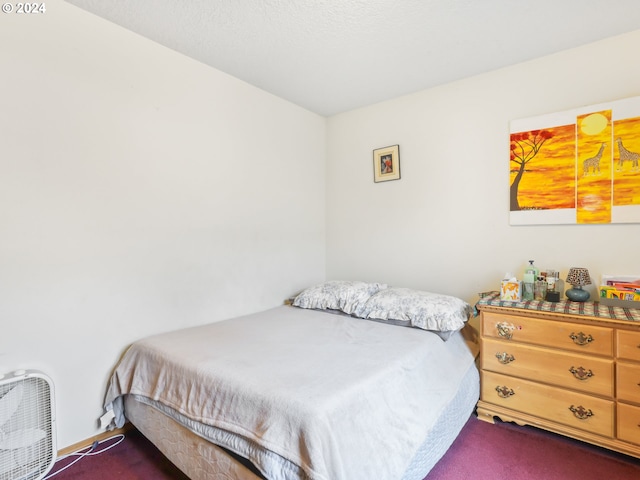 bedroom with dark carpet