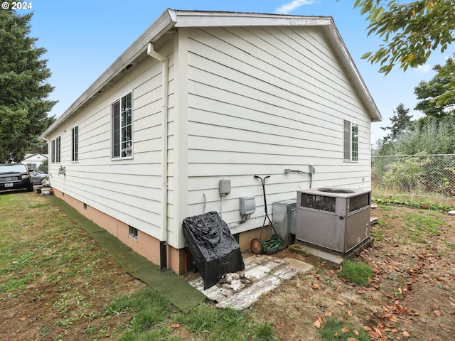 view of property exterior featuring a lawn