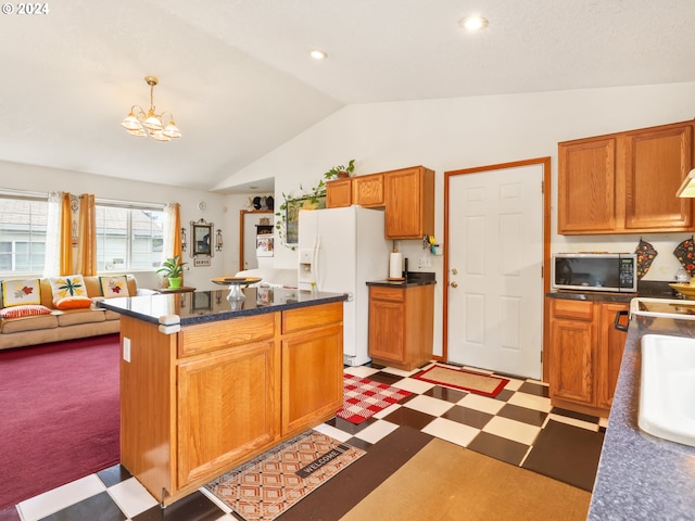 kitchen with dark carpet, white fridge with ice dispenser, lofted ceiling, a kitchen island, and an inviting chandelier