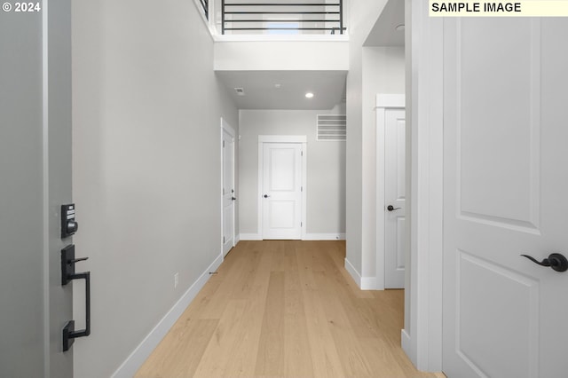 hallway with light wood-type flooring