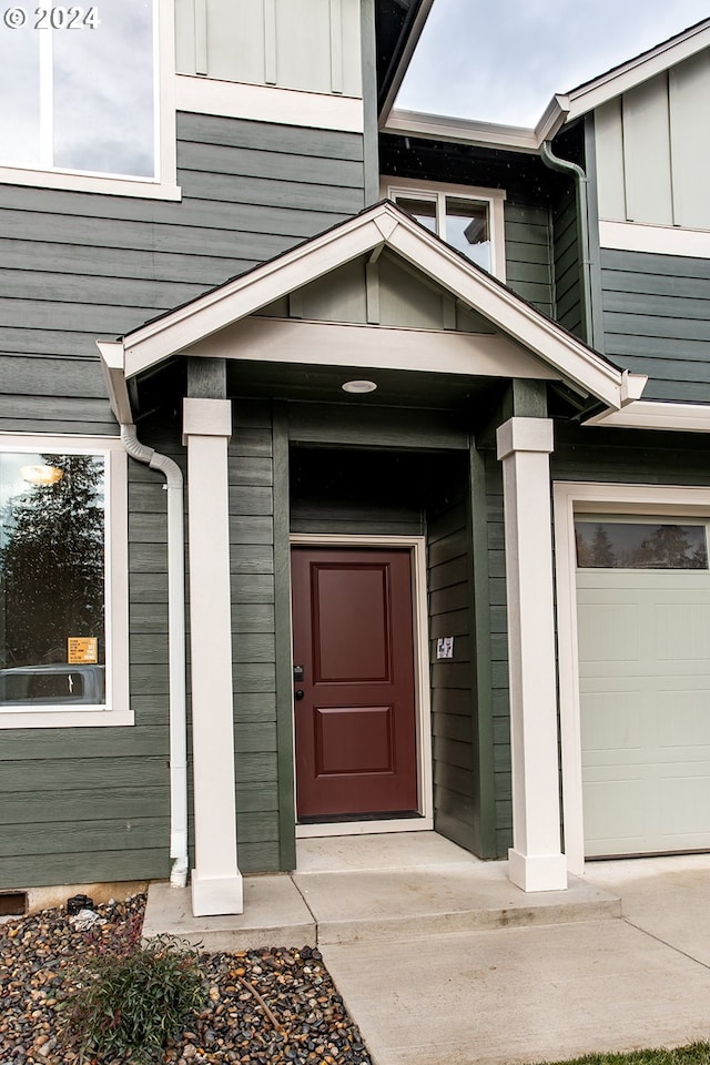 property entrance with a garage