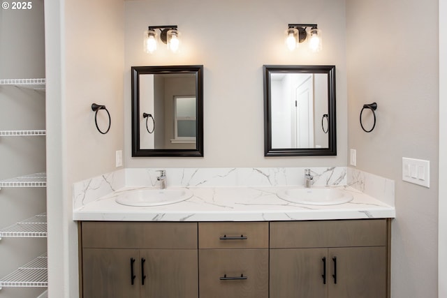 full bath featuring double vanity and a sink