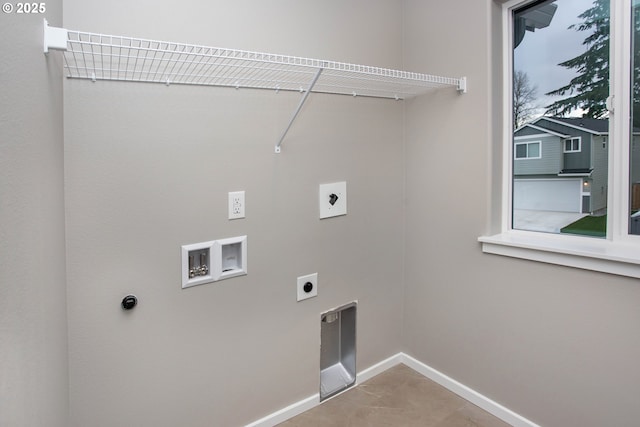 laundry room featuring laundry area, hookup for a washing machine, electric dryer hookup, and baseboards