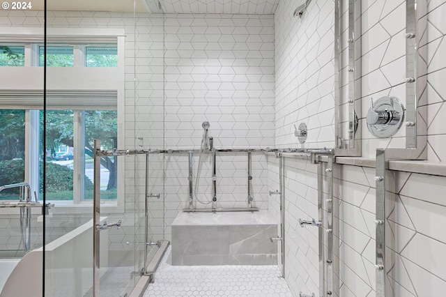 bathroom featuring tile patterned flooring and plus walk in shower