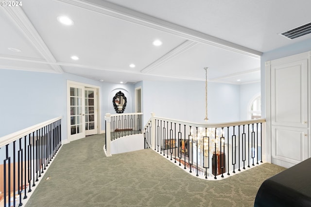 corridor with french doors, beamed ceiling, carpet floors, and coffered ceiling