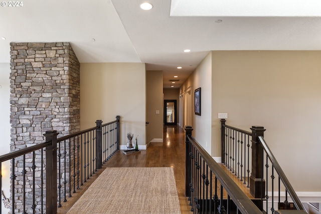 corridor featuring dark hardwood / wood-style floors