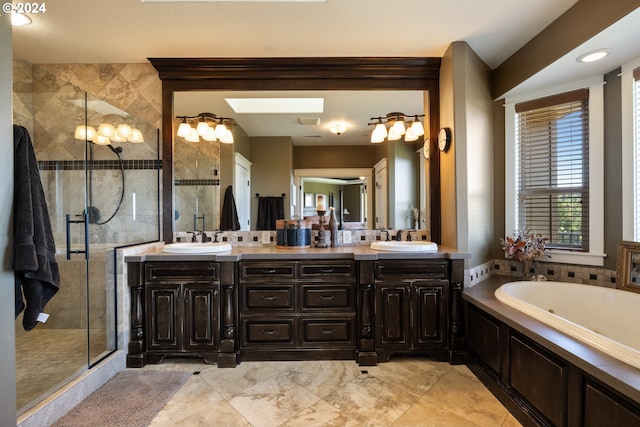 bathroom featuring shower with separate bathtub and vanity