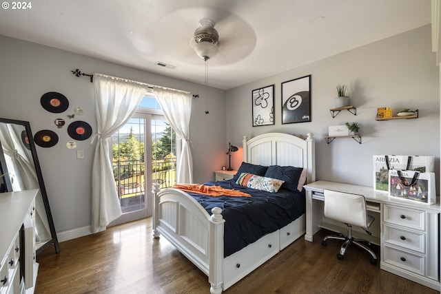 bedroom featuring access to exterior, ceiling fan, and dark wood-type flooring