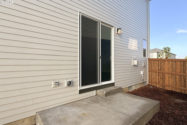 doorway to property featuring a patio