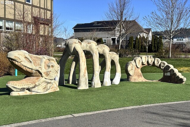 community / neighborhood sign with a lawn