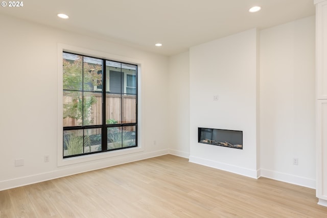 unfurnished living room with light hardwood / wood-style floors