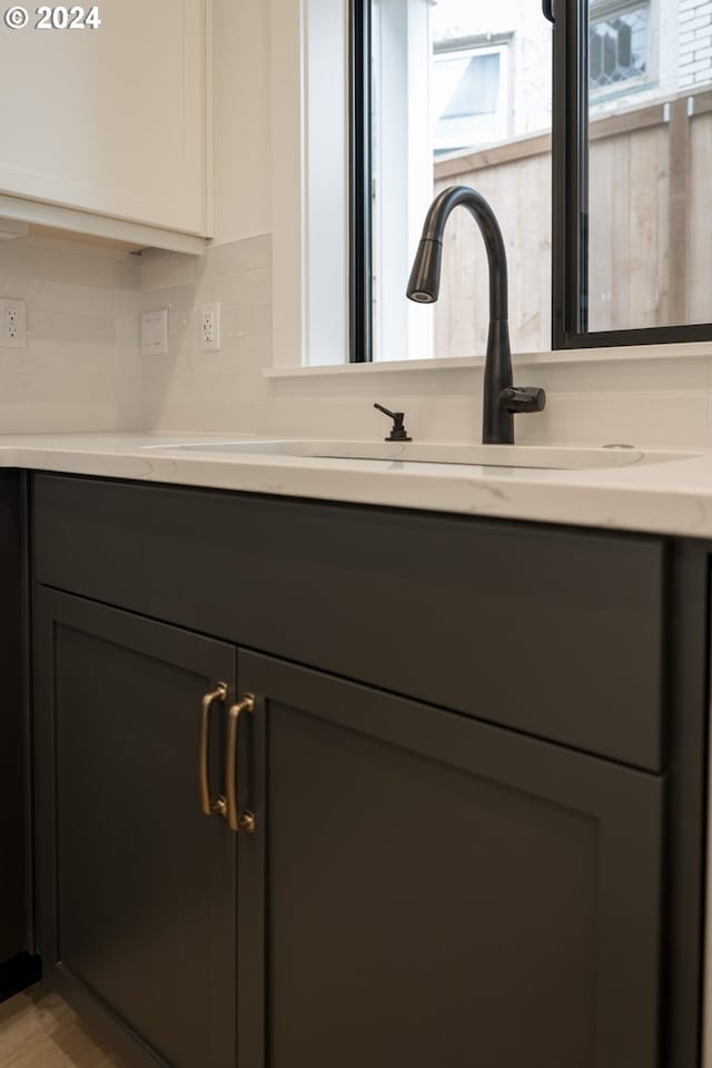 details with sink and decorative backsplash