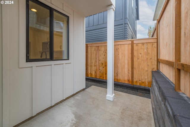 view of side of home with a patio