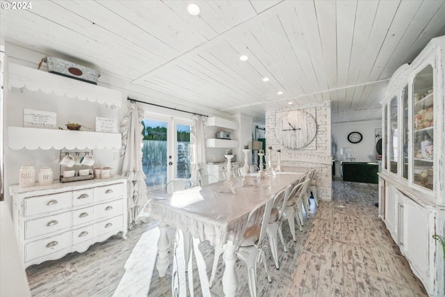 dining area featuring wood ceiling, light hardwood / wood-style flooring, and french doors