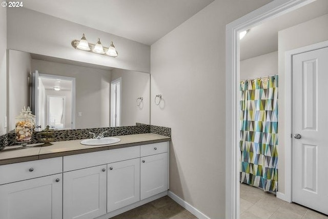 bathroom with tile patterned flooring and vanity