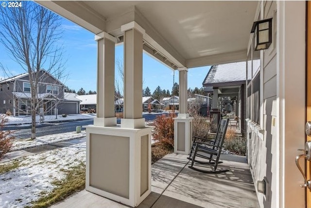 snow covered patio with covered porch