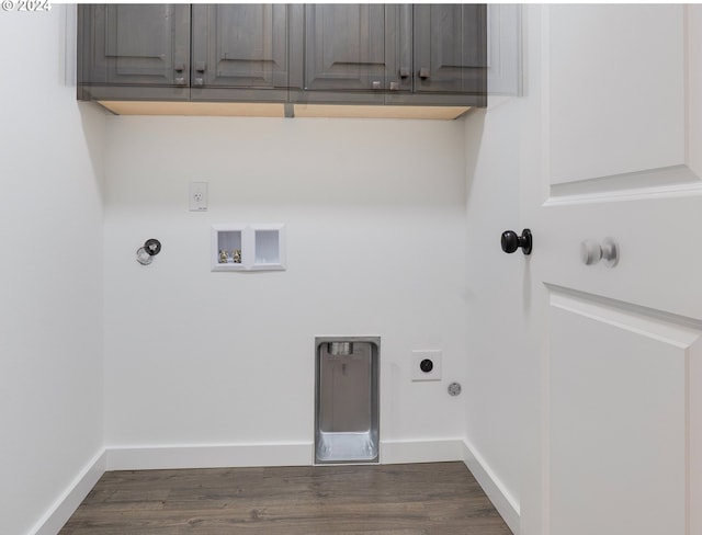 washroom with hookup for an electric dryer, hookup for a washing machine, dark hardwood / wood-style flooring, cabinets, and gas dryer hookup