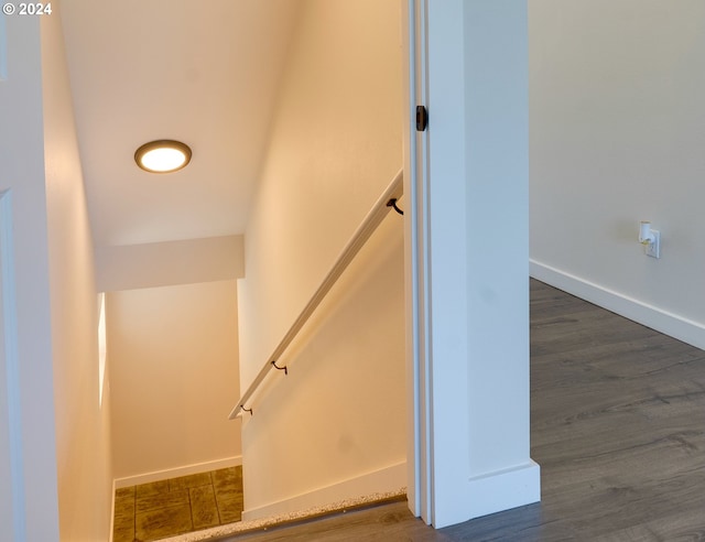 staircase with wood-type flooring