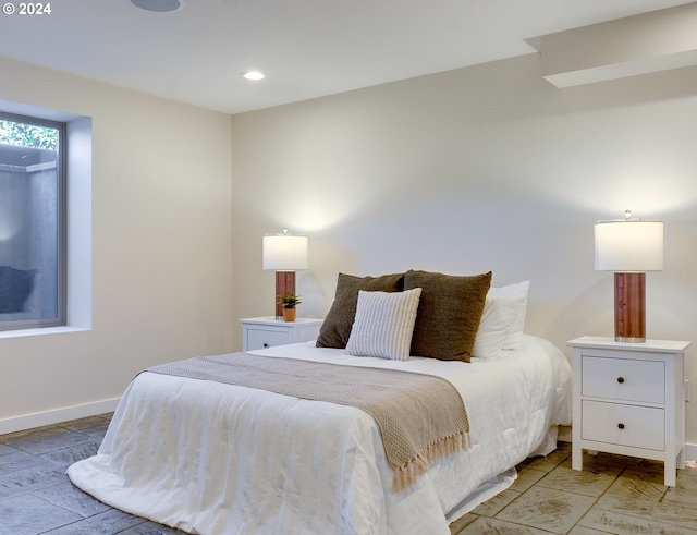 bedroom with hardwood / wood-style floors