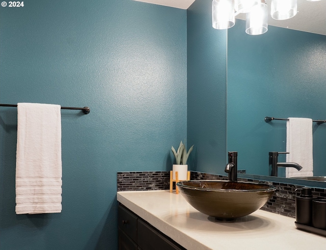 bathroom featuring decorative backsplash and vanity