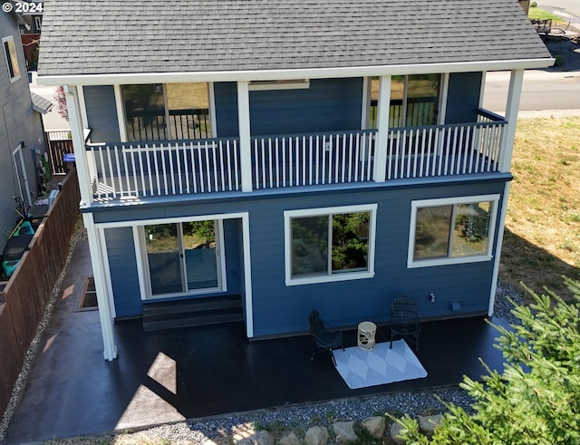 rear view of house with a balcony