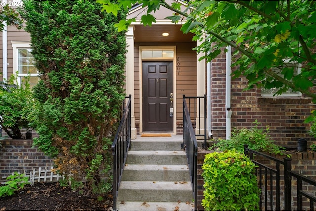 entrance to property with brick siding