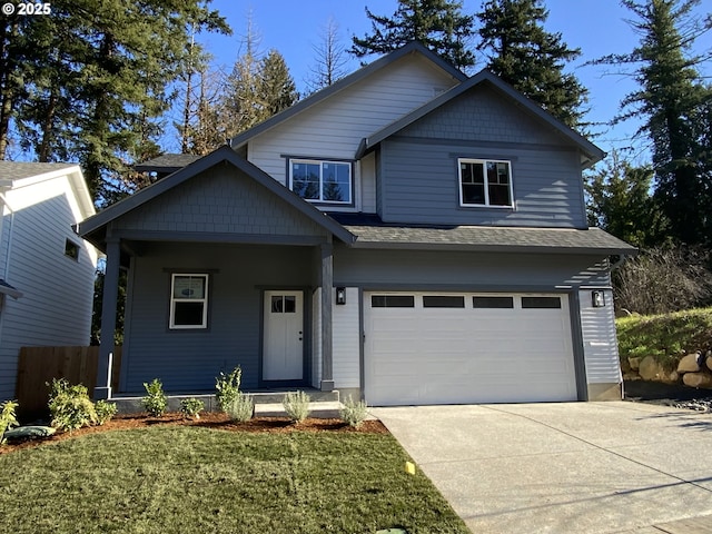 view of front facade with a garage and a front yard