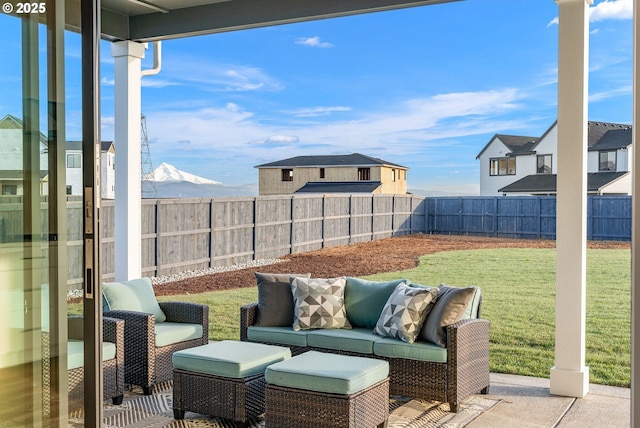 view of patio / terrace featuring outdoor lounge area and a mountain view