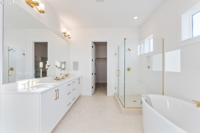 bathroom with tile patterned flooring, vanity, plenty of natural light, and independent shower and bath