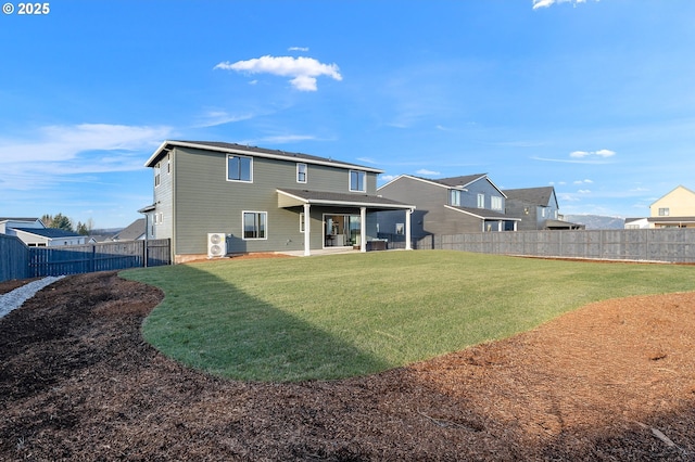 back of property featuring a patio area and a lawn