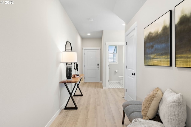 corridor with light wood-type flooring