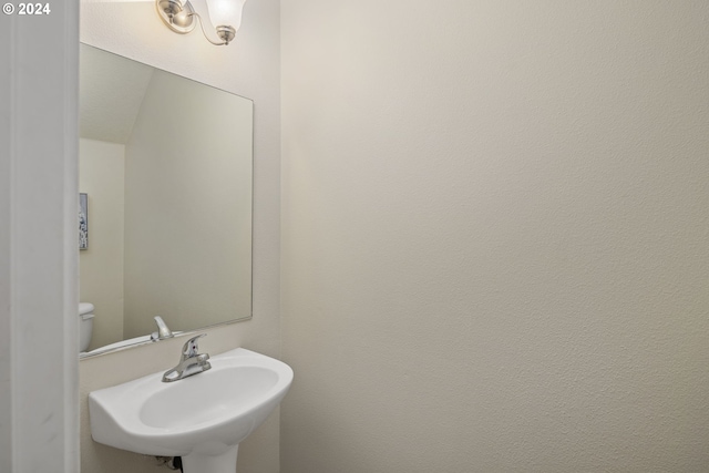 bathroom with toilet and sink