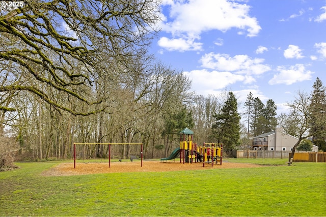 view of playground with a lawn