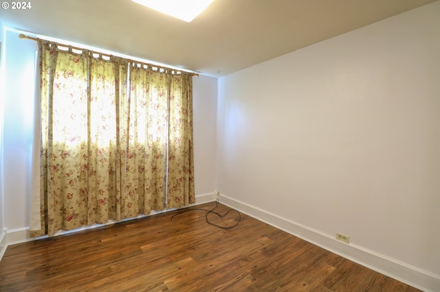 spare room with hardwood / wood-style floors