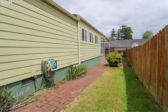 view of property exterior featuring a lawn