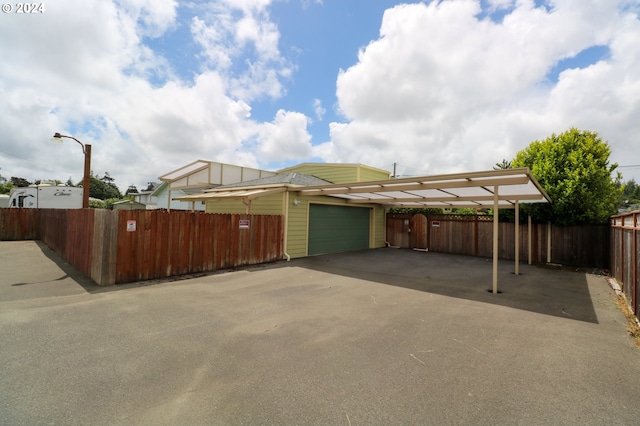 garage featuring a carport