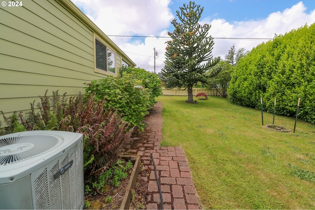 view of yard with central AC