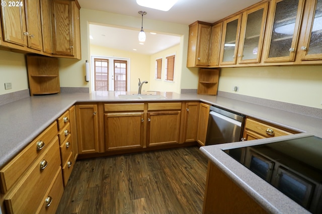 kitchen featuring dishwasher, sink, hanging light fixtures, vaulted ceiling, and dark hardwood / wood-style floors